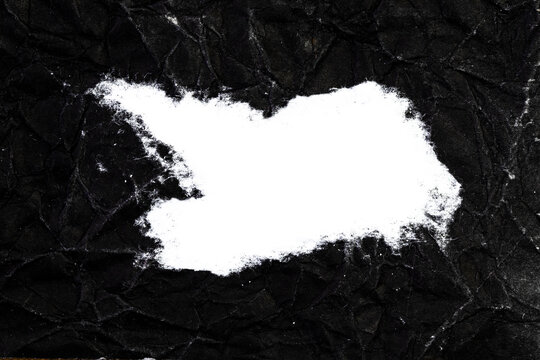 Ripped crumpled black paper with space