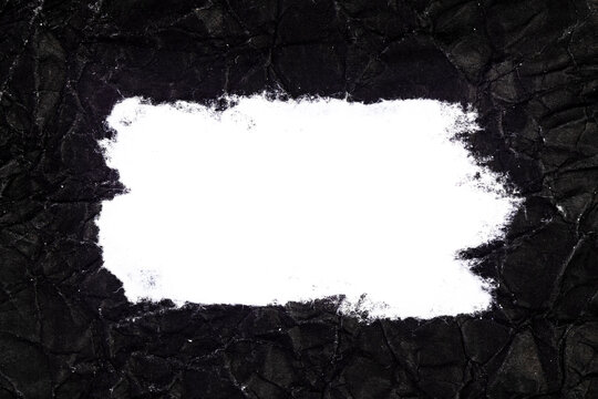 Ripped crumpled black paper with space