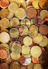 Shiny euros and cents as a background, top view