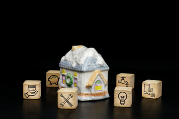 Household expenses concept, cube wood with home expenses, Water bills, electricity bills, card bills, credit, phone bills, house repairs icons.	