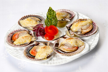 oysters, plate of oysters in the shell with melted cheese, oysters au gratin with soy sauce on a white background