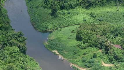 Fototapeta na wymiar aerial view tropical river landscape take a photo from helicopter air patrol.