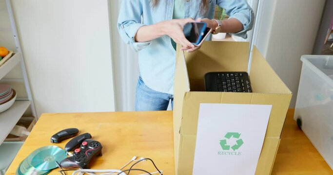 woman is recycling at home