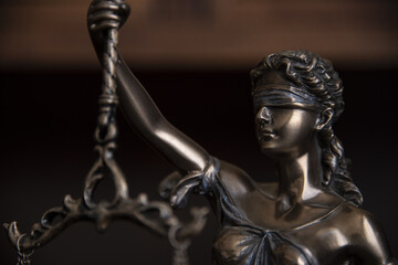 Fototapeta na wymiar Law and judgment concept. Figure of Lady Justice in notary office close-up.