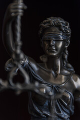 Law and judgment concept. Figure of Lady Justice in notary office close-up.