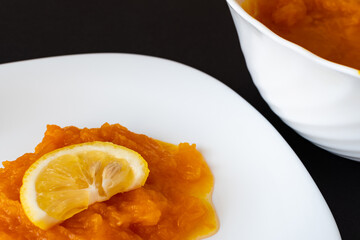 natural pumpkin porridge with lemon slice, healthy food, diet food