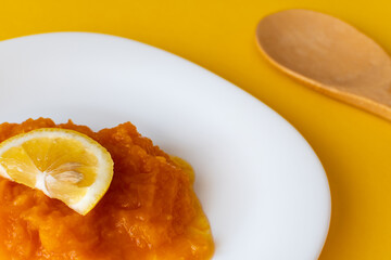 natural pumpkin porridge with lemon slice, healthy food, diet food