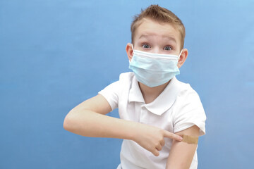a child in a protective mask was given a vaccine against the disease, coronavirus or covid-19.