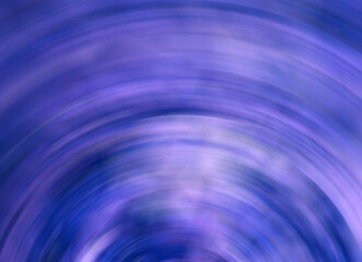 Abstract purple colored blurred background with light patches