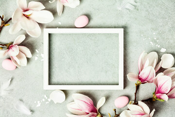 Easter mock up with Photo frame, space for text, beautiful spring magnolia flowers and Easter...