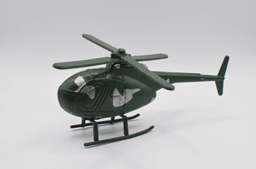 Fototapeta na wymiar military helicopter.a toy on a white background.