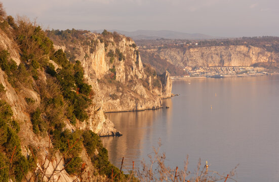Duino cliffs and Adriatic coastline during a winter sunset near Trieste, Italy