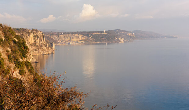 Duino cliffs and Adriatic coastline during a winter sunset near Trieste, Italy