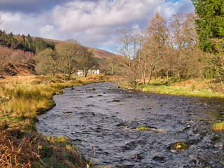 The River Dunsop near the village of Dunsop Bridge in the Forest of Bowland in Lancashire in the north of the UK. Taken on a sunny day in winter.