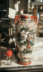 Fototapeta na wymiar Asian Vase in Thrift Shop Store