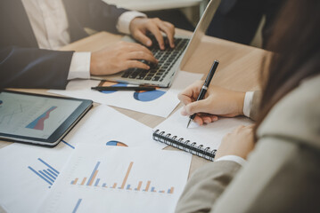 Close up hands of a business people take a meeting note to notebook