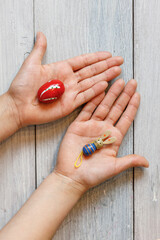 Hands with an egg and Easter bunny Top view