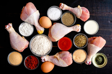 Ingredients for Air Fryer Southern Fried Chicken Drumsticks: Raw chicken legs, flour, spices, and other ingredients for southern fried chicken