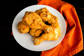 Air Fryer Southern Fried Chicken Chicken Drumsticks: Overhead view of a plate of breaded and air fried chicken legs
