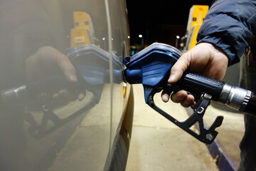 refueling the car with gasoline