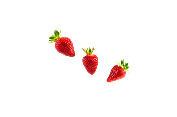 Red strawberries with green leaves on a white background