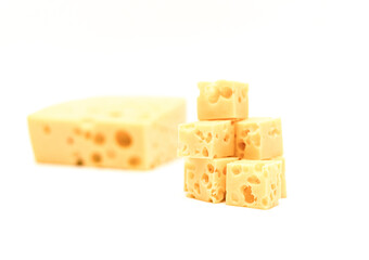 Dairy products, natural square slices of cheese with holes on a white background