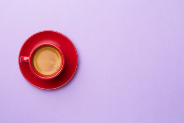 Obraz na płótnie Canvas Cup of delicious coffee on color background, top view