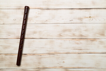 Armenian national musical instrument duduk on wooden background. Top view