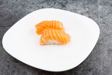 Salmon sushi shot on light background