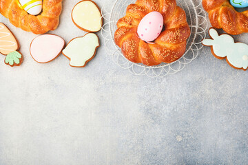Spanish Easter cake. Traditional mona de pascua typical in Spain with boiled eggs eaten inside on light grey background. Typical food of the Spanish pastry Mona de Pascua. Top view. Mock up.