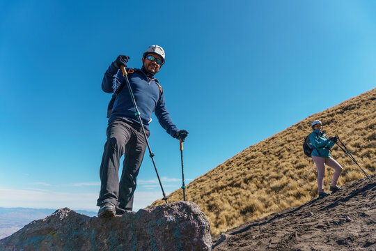 Two female hikers enjoying valley view