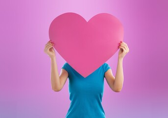 Charming lady with heart postcard on colored background