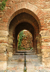 Gateway of the Cuartos of Granada in the Alcazaba of Malaga, capital of the Costa del Sol, Andalusia, Spain