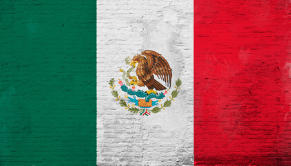 Naklejka premium Full frame photo of a weathered flag of Mexico painted on a plastered brick wall.