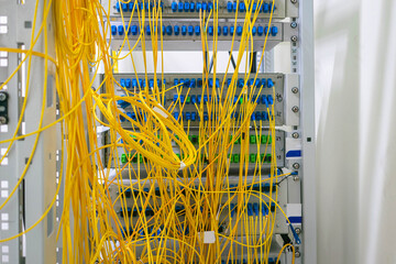 Lots of fiber optic internet cables connected to the ODF panel.
Yellow wires are randomly...