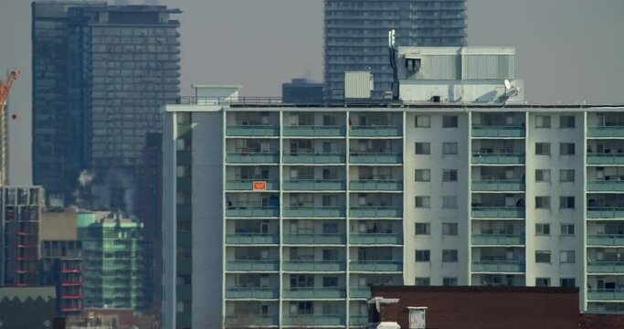 Establishing shot of an apartment building in Toronto during the winter. 4k footage.