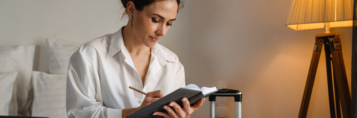 Smiling mid aged brunette white businesswoman