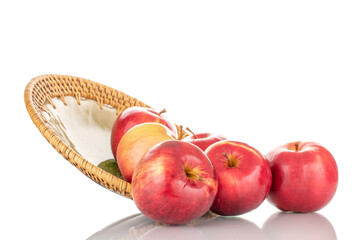 Several ripe red apples with a ceramic dish, macro, isolated on a white background.