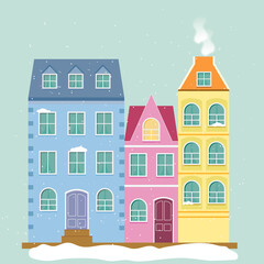 Scandinavian style houses on a snowy day. Blue, pink and yellow houses