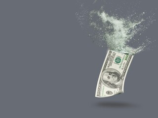 Inflation, hyperinflation, dollar stagflation. Dollar bill sprayed on a background.
