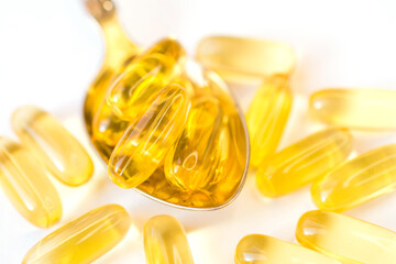 omega 3 vitamins yellow capsules close