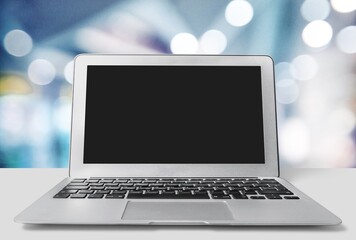 Laptop displaying blank screen on the desk