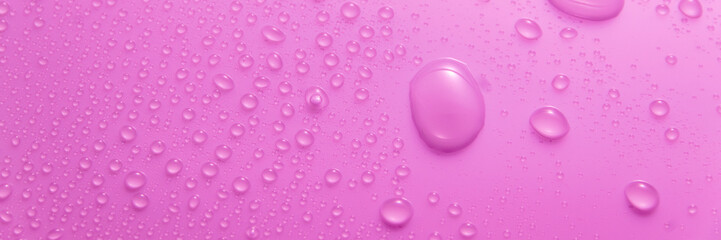 Violet pastel water drops on light shiny surface