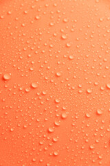 Coral colorful pastel water drops on light shiny surface