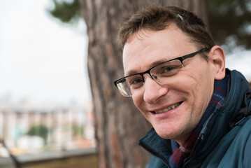 Obraz premium Outdoor portrait of a 40 year old man, smiling