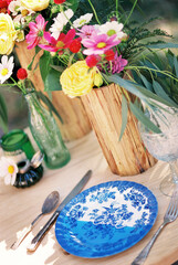 Table Setting with Antique Plate and Cutlery and Fresh Flowers
