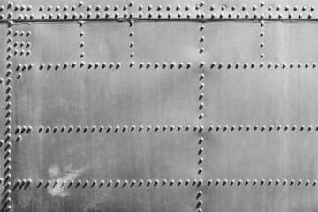 Rivets on Aircraft Fuselage Abstract