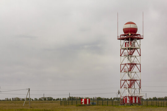 Meteorological station with lightning rods in the suburbs on the background of the cloudy sky before the rain. Weather monitoring and prediction concept.