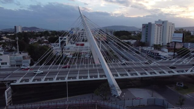 dusk flying clockwise around Matute Remus Bridge in Guadalajara Mexico