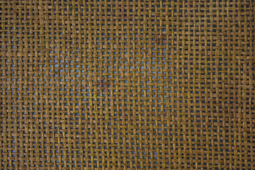 brown texture of woven fabric from straw or paper close up